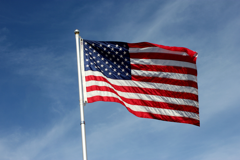 Flag of the USA against a blue sky background - Patient Guard uses this image to represent its USA related medical device and IVD consultancy services.
